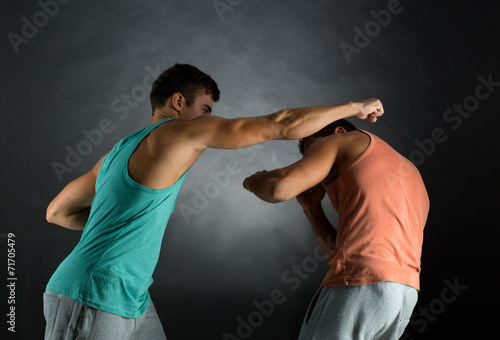 young men wrestling