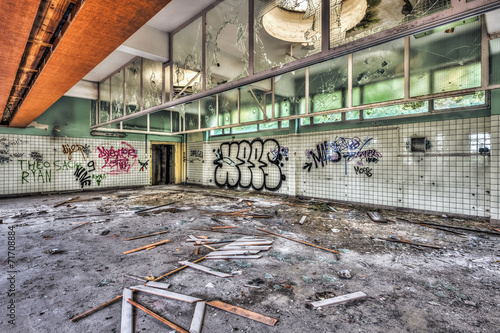 Vandalized washroom in an abandoned hospital photo