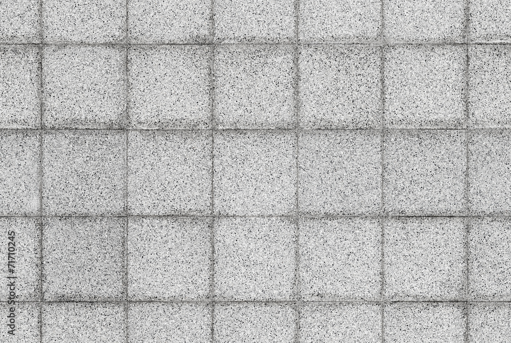 Fototapeta premium Seamless background texture of gray stone tiling on the wall