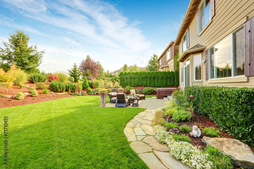 Slika na platnu Luxury house exterior with impressive backyard landscape design