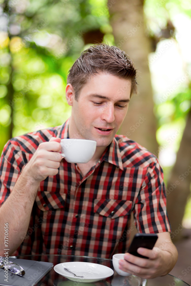 Businessman With Coffee Using Mobile Phone Businessman With Coffee Using Mobile Phone