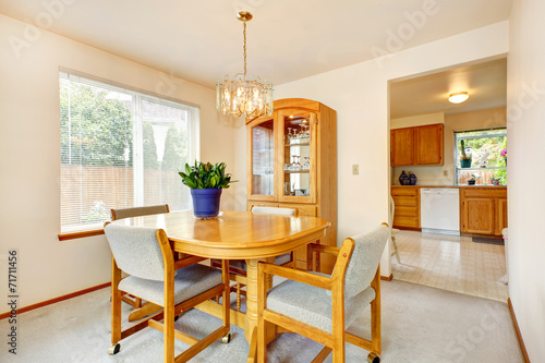Bright dining area with maple furniture