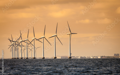 wind turbines power generator farm along coast sea © Voyagerix