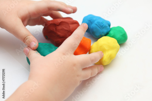 Child playing with playdough photo