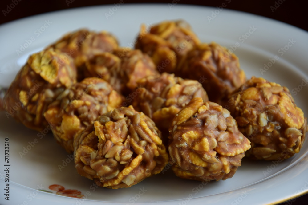 Round sweet specialities with flakes and caramel Round sweet specialities with flakes and caramel
