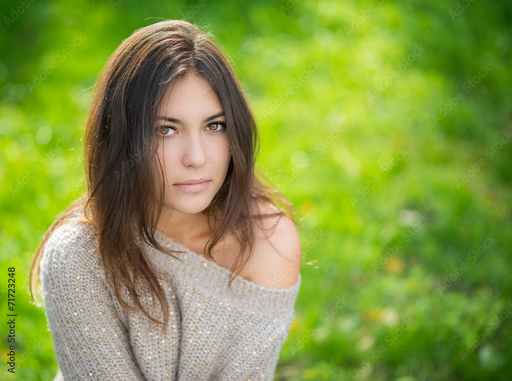 Portrait of young beautiful woman in sweater. Portrait of young beautiful woman in sweater.