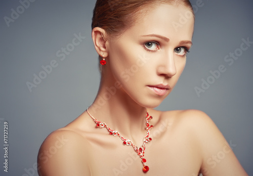 beauty girl with red jewelry necklace and earrings