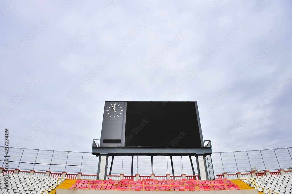Obraz premium Football scoreboard and empty tribune
