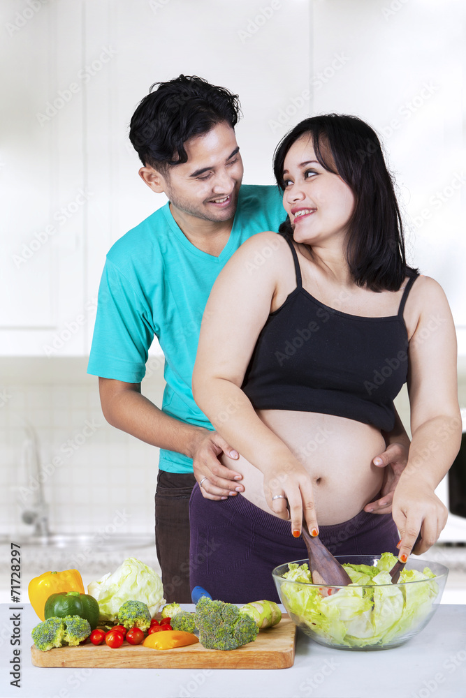 Romantic family making salad together Romantic family making salad together