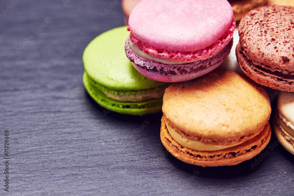 Macaroons in different colours on black slate Macaroons in different colours on black slate