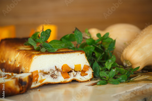 Cottage cheese casserole with slices of pumpkin and nuts