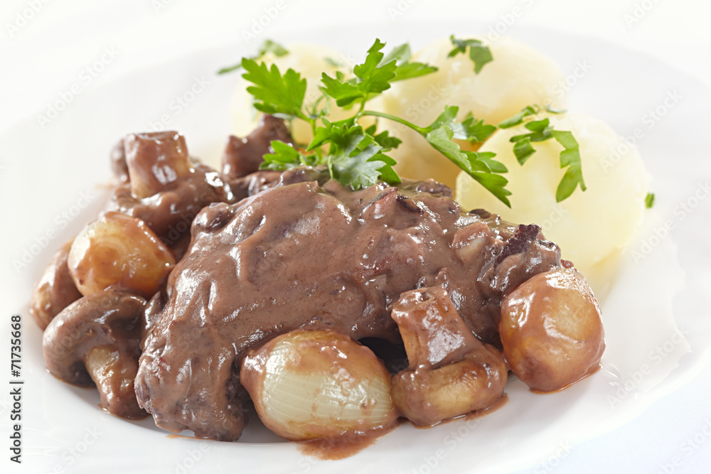 Chicken in red wine with onions, mushrooms and bacon Chicken in red wine with onions, mushrooms and bacon
