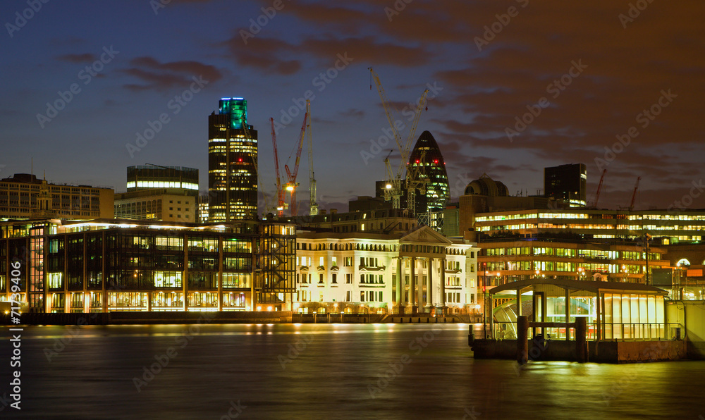 London - quay by daylight and skyscrapers in background