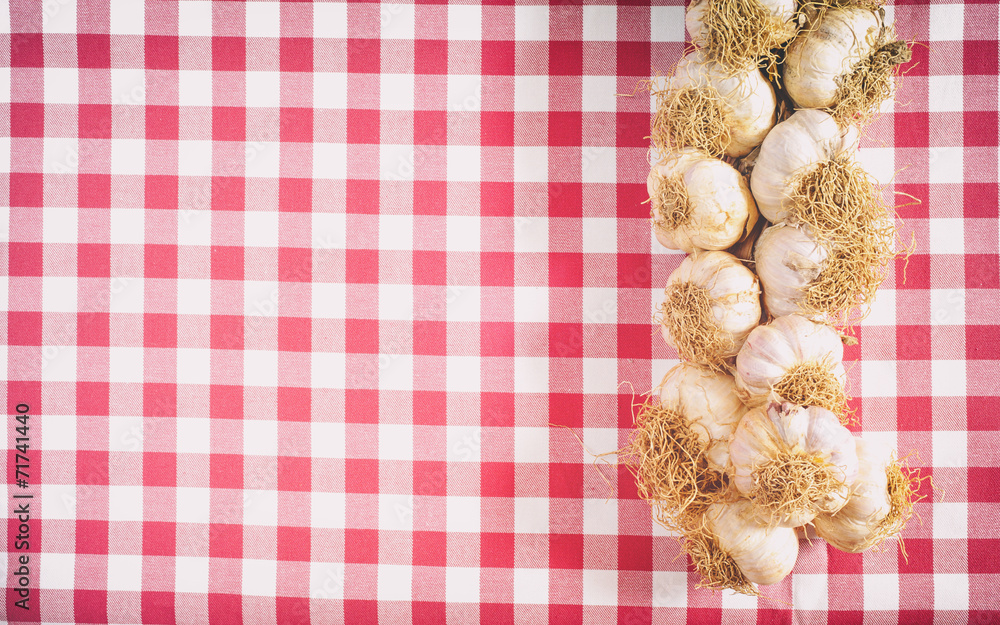 Garlic on a red and white background