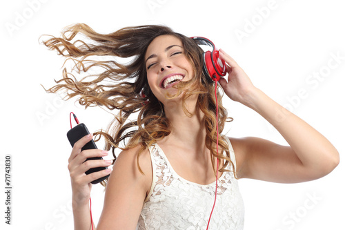 Happy girl dancing and listening to the music