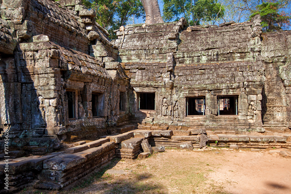 The ancient ruins of a historic Khmer temple in the temple compl