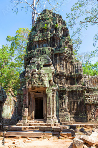 The ancient ruins of a historic Khmer temple in the temple compl photo