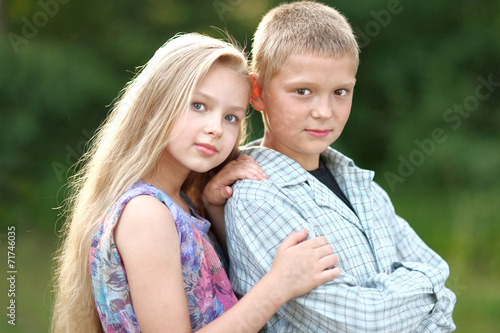 Portrait of a boy and girl in summer