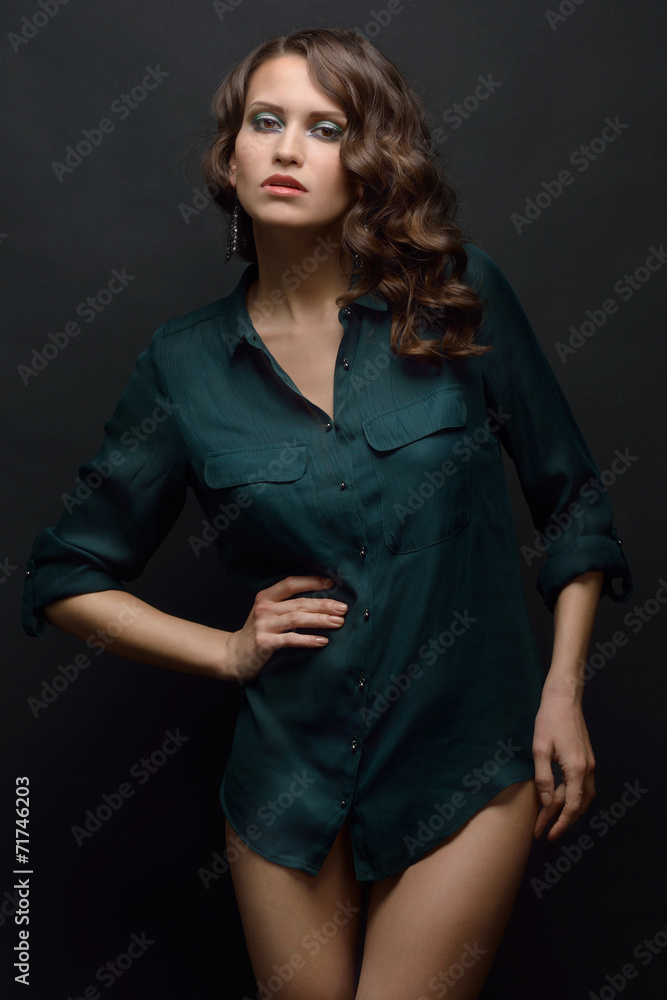 Beautiful woman in a green shirt and black panties. Beautiful woman in a green shirt and black panties.