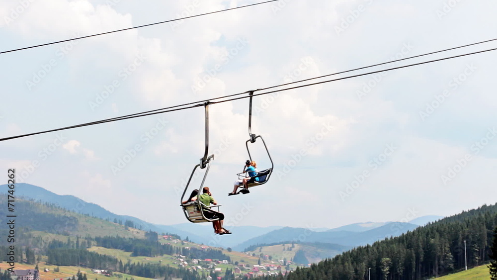 mountain lift with tourists moves in Carpathians, closeup mountain lift with tourists moves in Carpathians, closeup