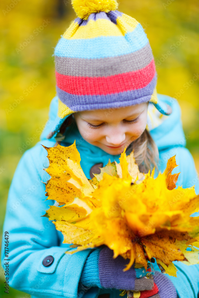 Little girl outdoors on autumn day