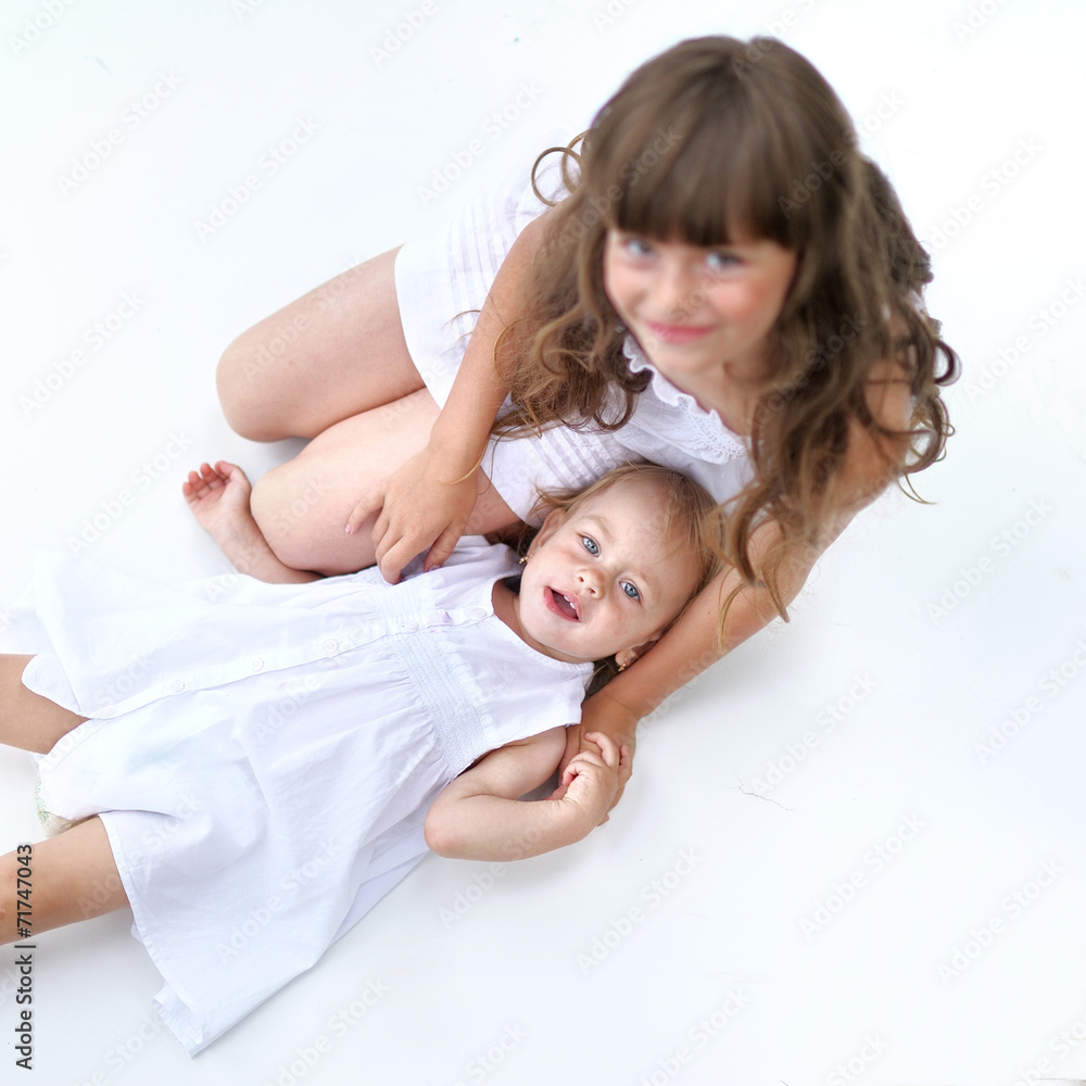 portrait of two sisters in white dresses portrait of two sisters in white dresses