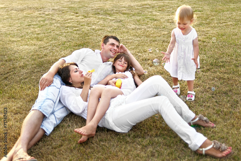 portrait of a happy family in summer nature portrait of a happy family in summer nature
