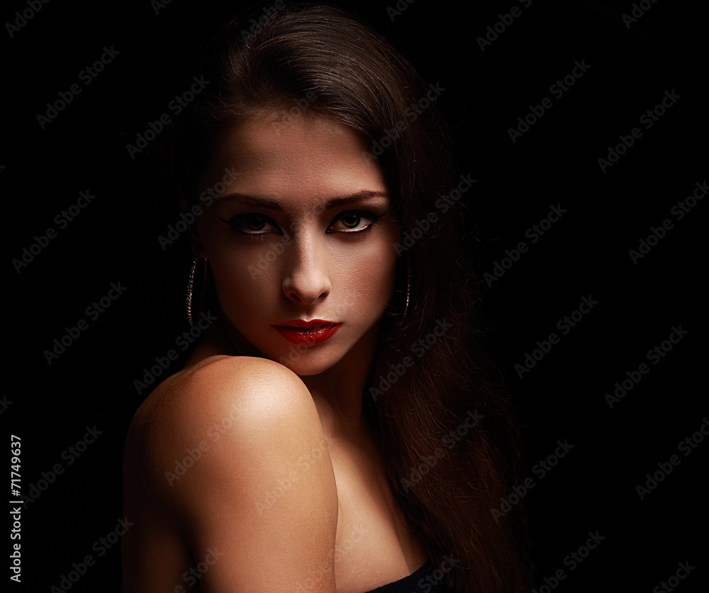 Sexy makeup female in shadows on black background Sexy makeup female in shadows on black background