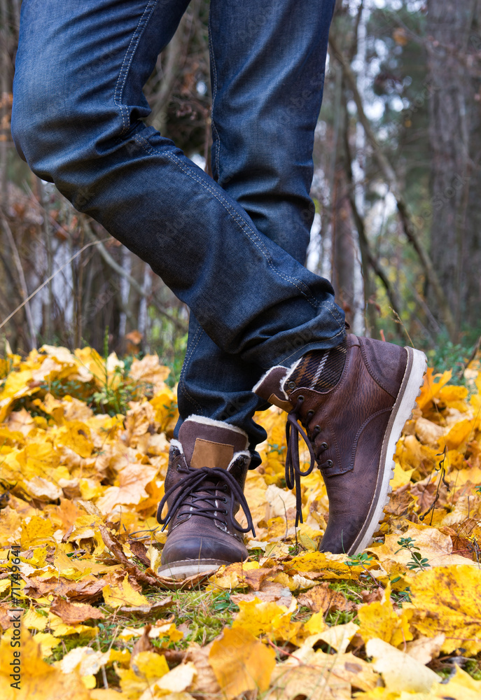 Man's legs wearing jeans and boots Man's legs wearing jeans and boots