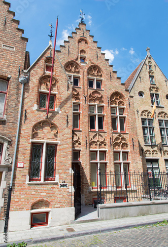 Bruges - Typicaly brick house on Moerstraat street photo