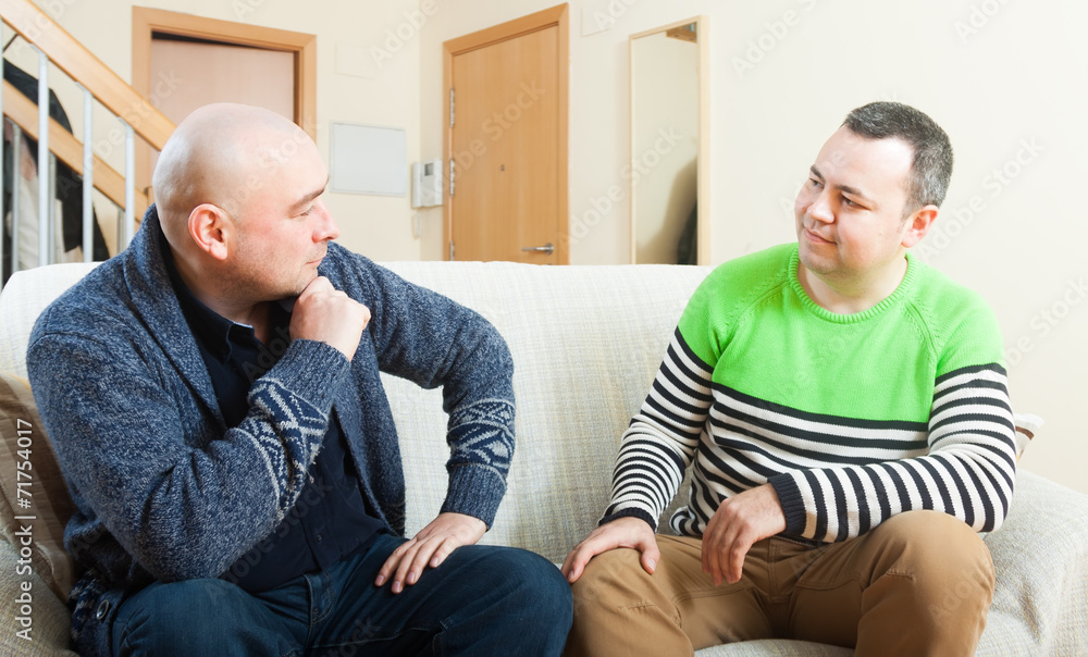 men discussing at home men discussing at home