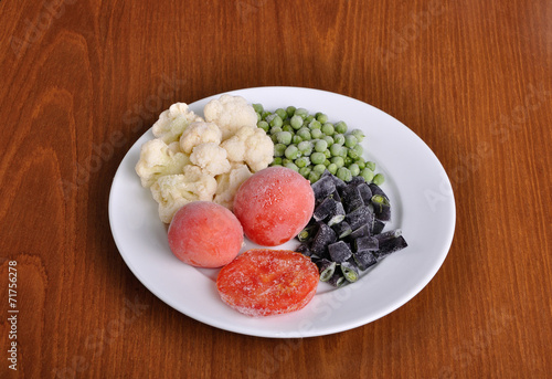 frozen tomato, asparagus, peas and cauliflower on a plate