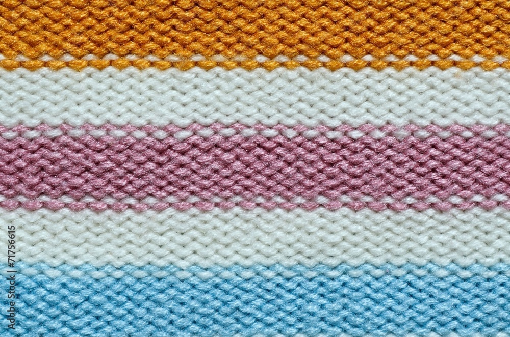 Knit woolen texture. Fabric striped background