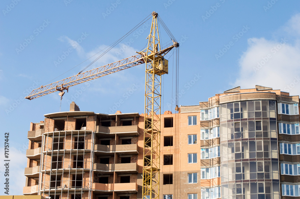 Construction of the new brick building by means of the elevating