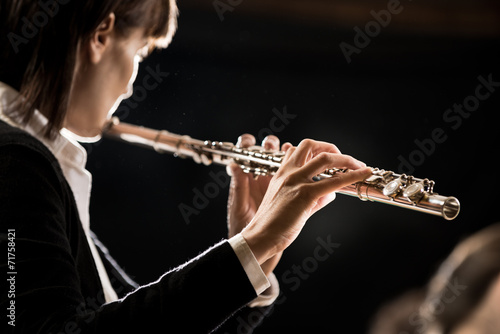 Female flutist performing
