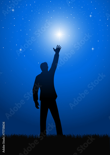 Silhouette of a male figure reaching out for the star