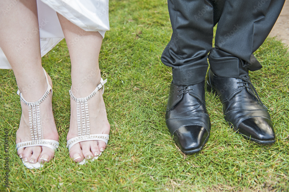 Bride and grooms feet at a wedding