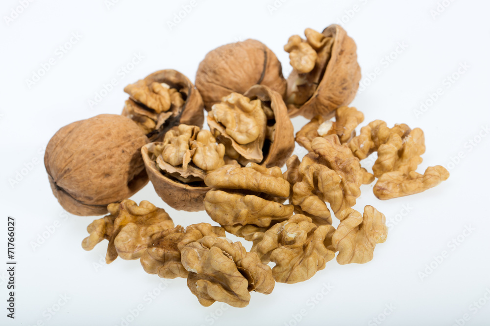 Fototapeta premium walnut and a cracked walnut isolated on the white background