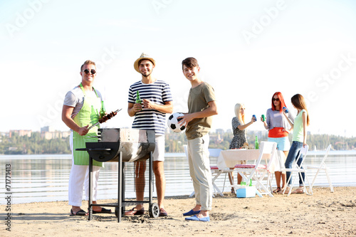 Young friends having barbec...
