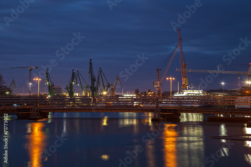 Big cranes and bridge at the shipyard at night. © Nightman1965