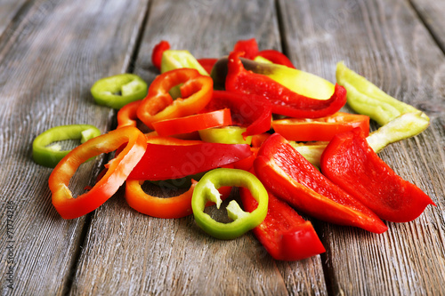 Sliced pepper on wooden background