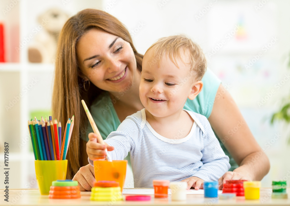 cute mother teach her son kid to paint cute mother teach her son kid to paint