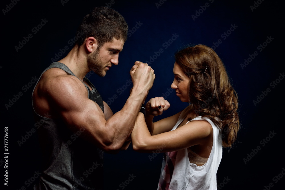 young athletic couple  in the gym