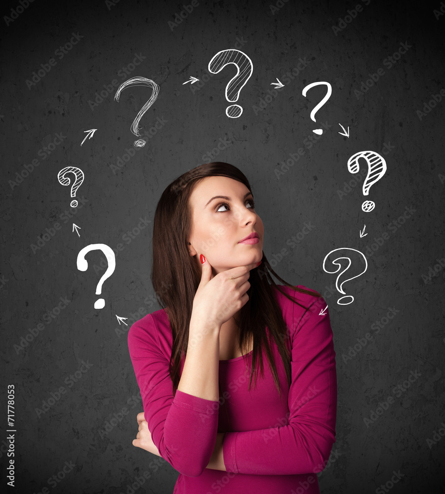 Young woman thinking with question mark circulation around her h Young woman thinking with question mark circulation around her h