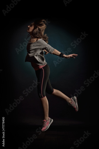 young woman dancing in studio © bereta