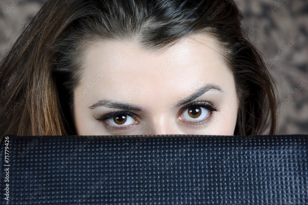 Fototapeta premium brown eyes closeup peering