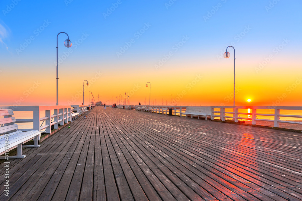Sunrise at wooden pier (molo) in Sopot, Poland