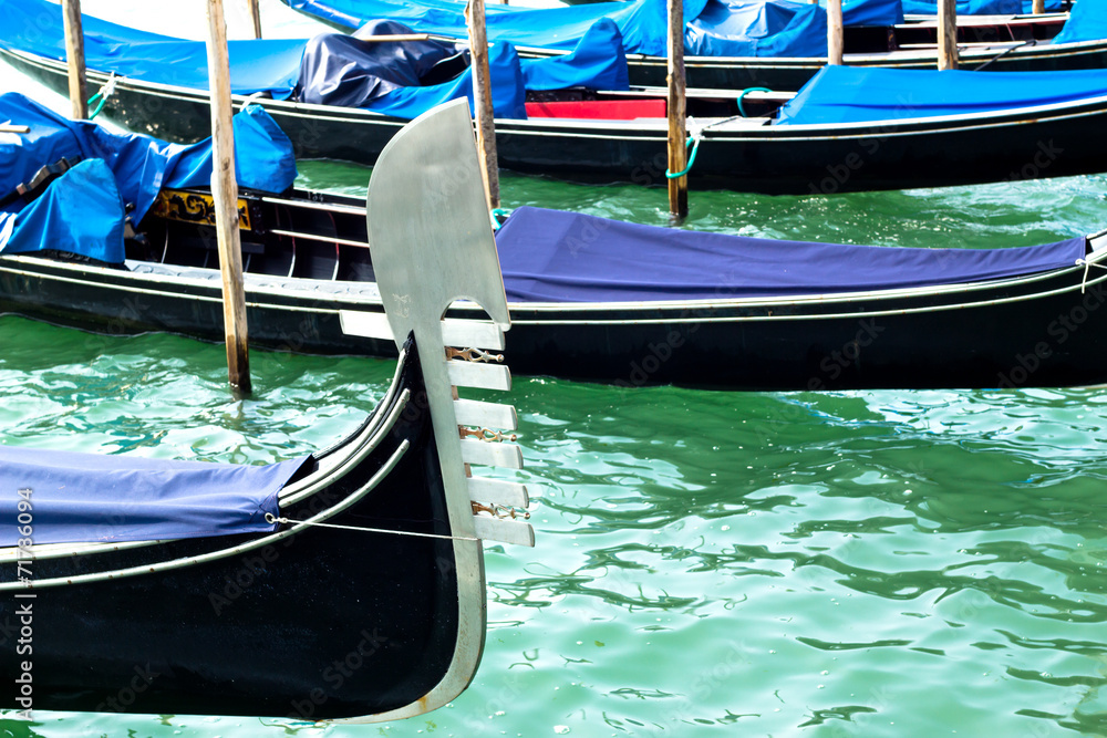 Ferro of gondola docked on the venetian lagoon