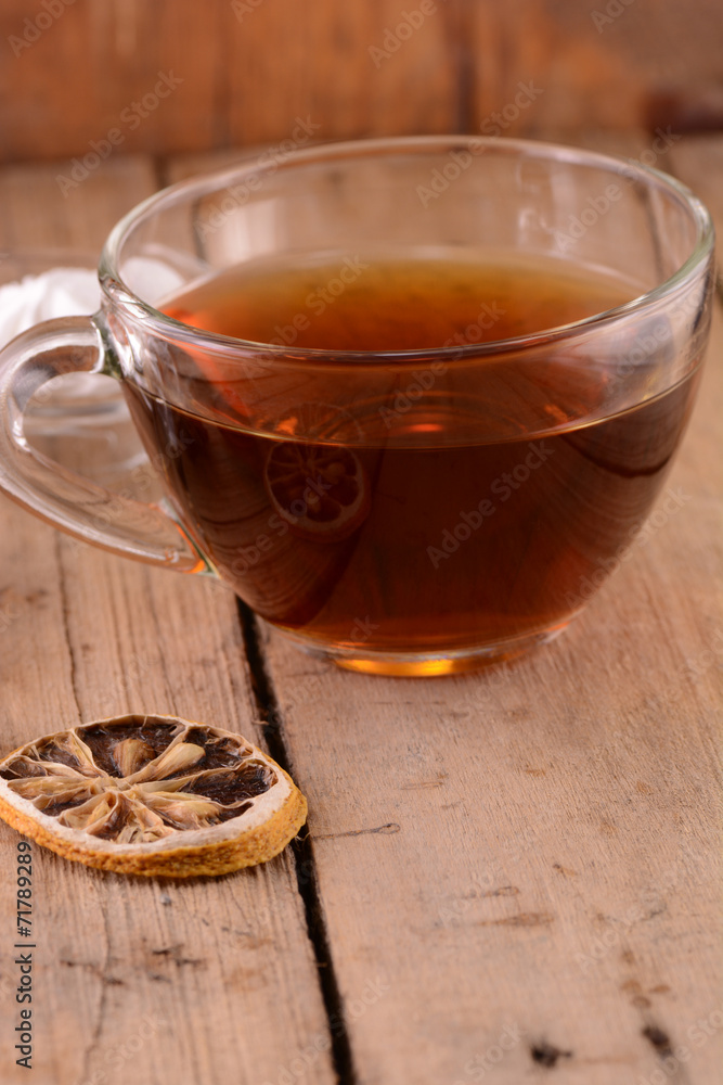 Fototapeta premium A cup of tea on wooden background