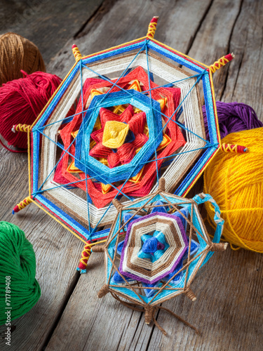 two knitted tibetan mandala from threads and yarn, selective foc